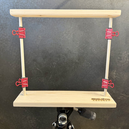 Revelation Archery paper tuner mounted to arca plate on tripod